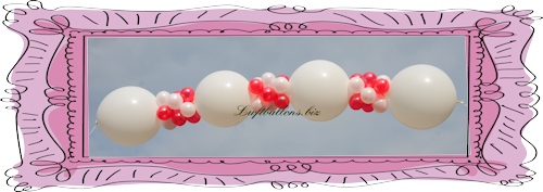 Girlande aus großen Girlanden-Luftballons und kleinen Mini-Luftballons